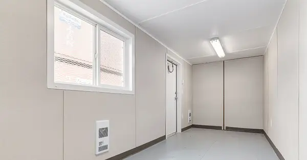 Container with wall paneling and flooring