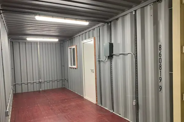 Container with interior lighting fixtures